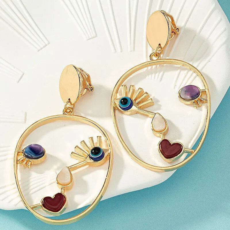 Creative Abstract Face Pendant Earrings For Women Gold-color Hollow Geometric Evil Eye Beads Dangle Earrings Female Jewelry