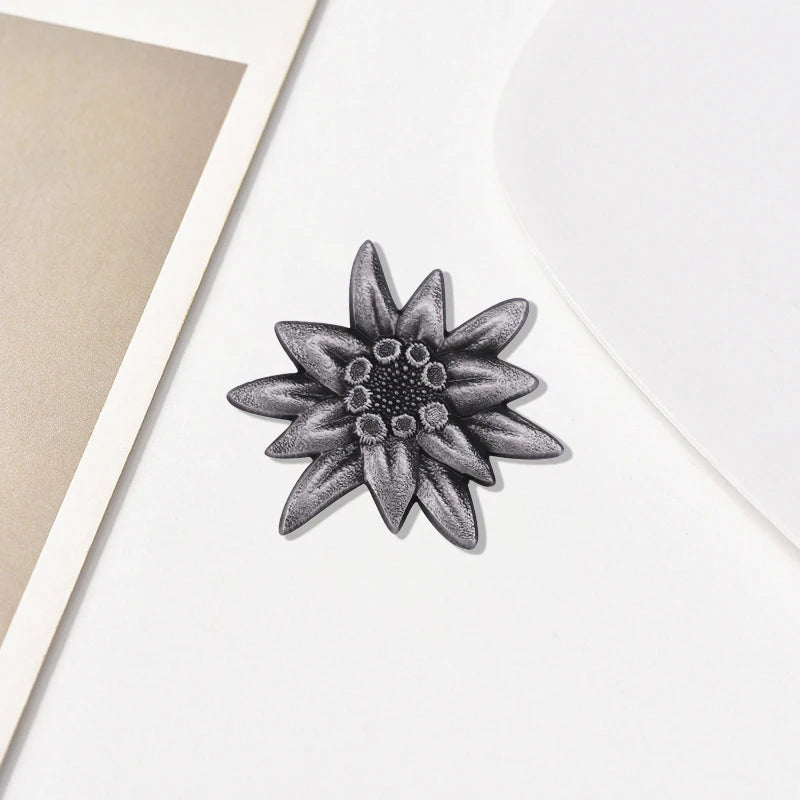 Retro edelweiss brooch. According to tradition, giving this flower to a loved one is a loyal commitment