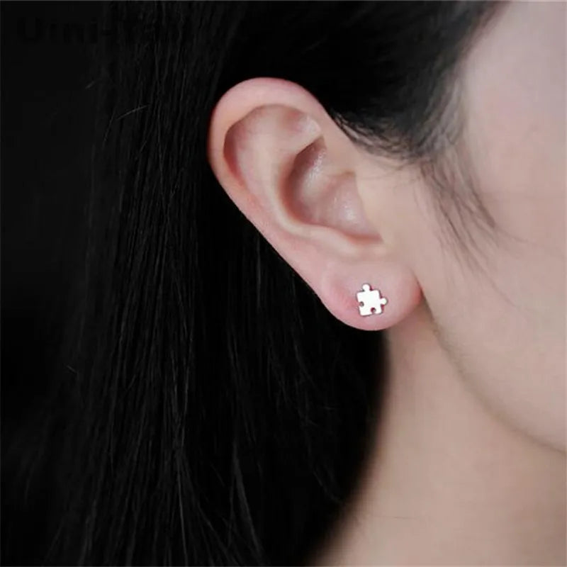 925 Tibetan silver child-friendly puzzle earrings wholesale Korean version of the simple wild cute live wave high quality ED296