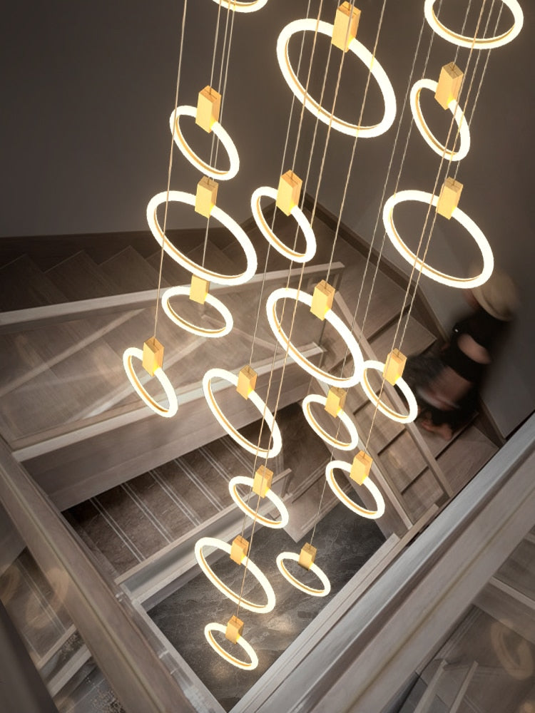 Candelabro LED moderno negro/dorado para interiores, iluminación de escaleras, anillo acrílico de hierro, luces decorativas para restaurante, lámpara colgante nórdica de lujo