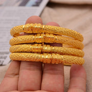 The Addis Stack | 4-Piece Gold-Tone Ethiopian Bangle Set