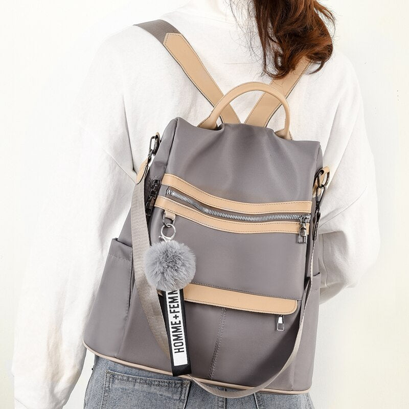 Mochila impermeable material de tela Oxford 2022 nuevo bolso de estilo universitario simple mochila para chica joven regalo colgante de bola de pelo