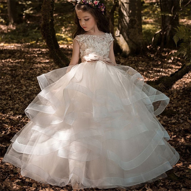 Nuevo vestido de niña de las flores Elegante Champagne Apliques de encaje Sin mangas Cascada Niños Vestidos de desfile para bodas Primera comunión Dres